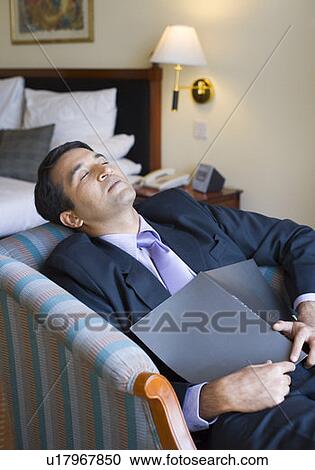 Businessman sleeping on a couch View Large Photo Image Stock Image - Businessman sleeping on a couch. Fotosearch
