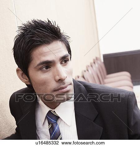 Close-up of a businessman in a conference room View Large Photo Image Stock Image - Close-up of a businessman in a conference room. Fotosearch