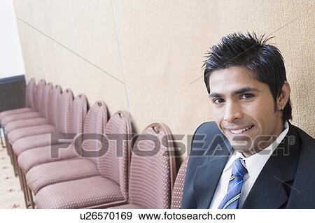 Stock Photo - Portrait of a businessman smiling. Fotosearch