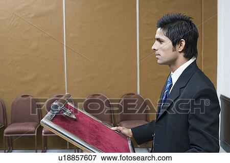Side profile of a businessman giving a speech View Large Photo Image Stock Photo - Side profile of a businessman giving a speech. Fotosearch