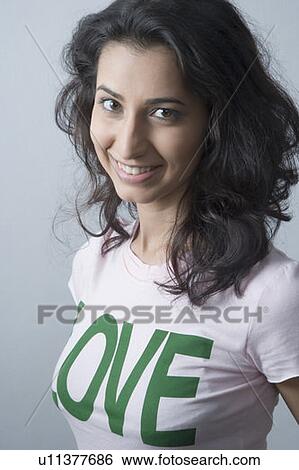 Stock Photograph - Portrait of a young woman smiling. Fotosearch