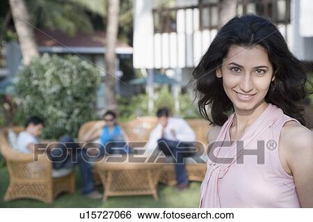 Stock Photograph - Portrait of a young woman smiling. Fotosearch