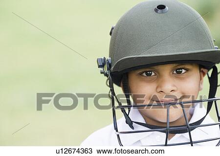 Portrait of a boy wearing sports helmet and smiling View Large Photo Image Stock Image - Portrait of a boy wearing sports helmet and smiling. Fotosearch