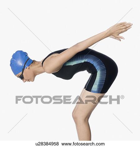 Stock Photo - Side profile of a young woman in diving position. Fotosearch