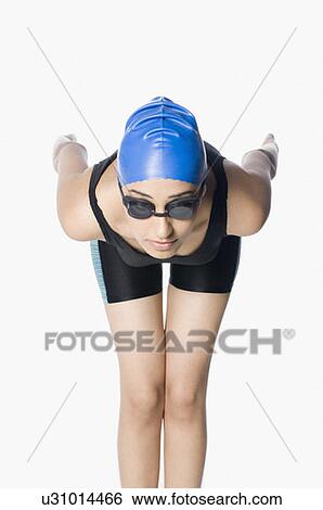 Young woman preparing to dive View Large Photo Image Stock Photograph - Young woman preparing to dive. Fotosearch