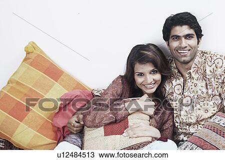 Portrait of a young couple smiling View Large Photo Image Stock Image - Portrait of a young couple smiling. Fotosearch