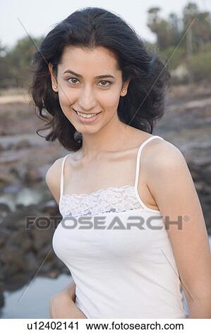 Stock Image - Portrait of a young woman smiling. Fotosearch